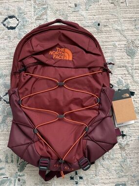 The North Face Borealis Burgundy Backpack with Orange Bungee Accents
